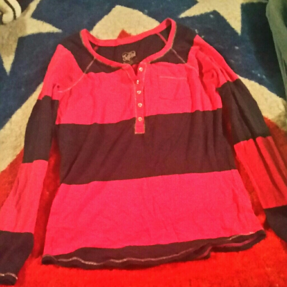 A long sleeve dark blue and pink shirt